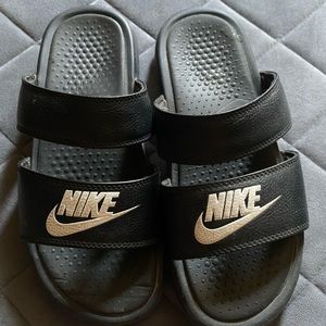 Black Nike slides